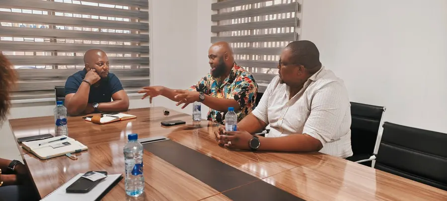 The JuaKali Events team in a planning meeting around a boardroom table